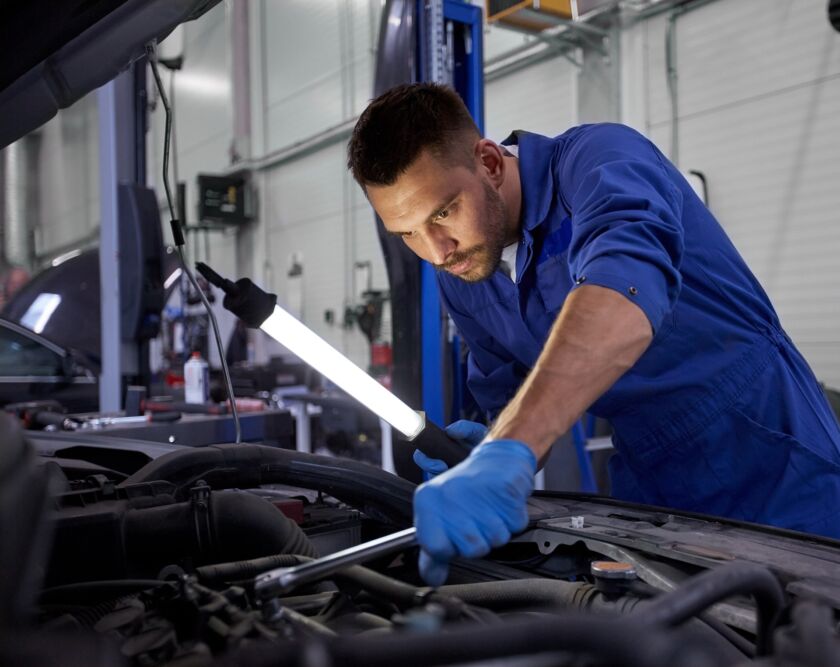 Mechanic performing car repair and maintenance in Tampa auto repair shop